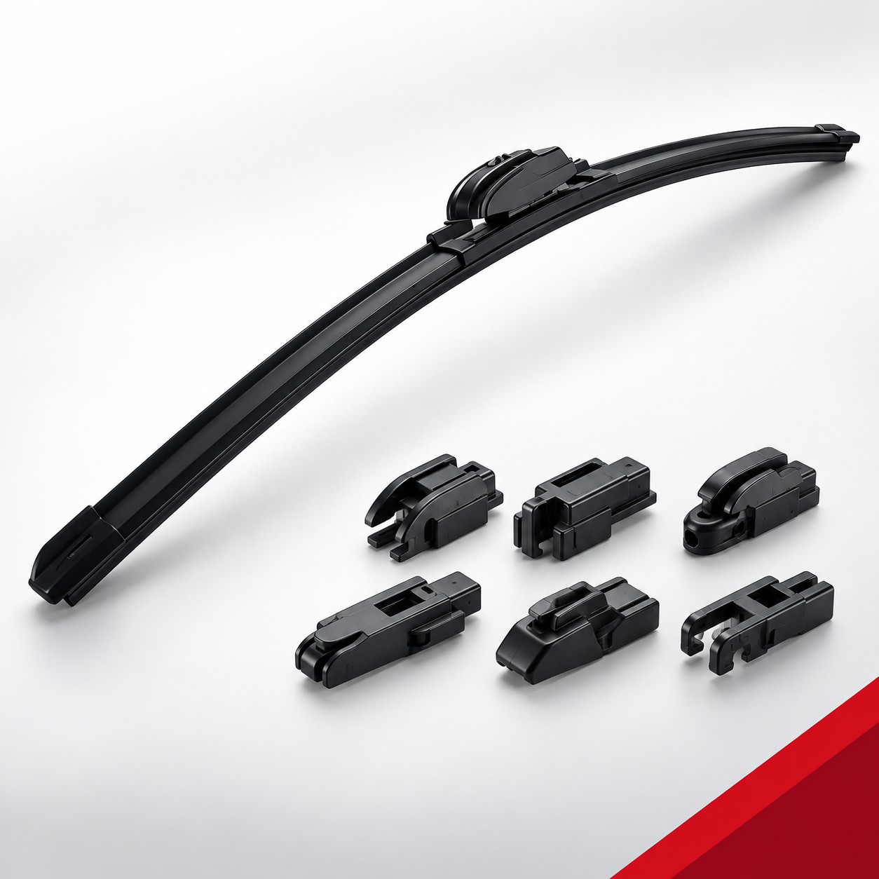 Multi-fit frameless windshield wiper blade and adapters